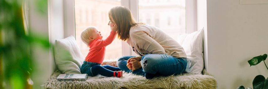 child and lady playing together