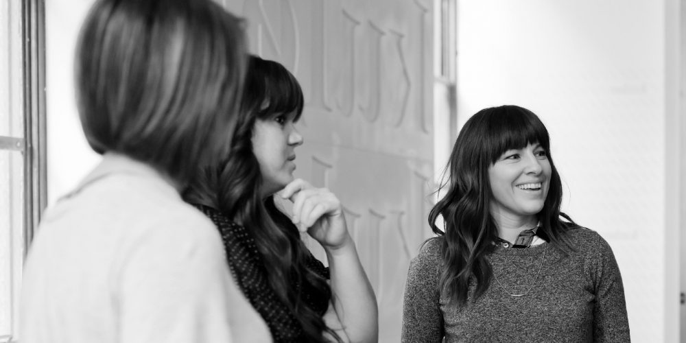 3 ladies looking at something