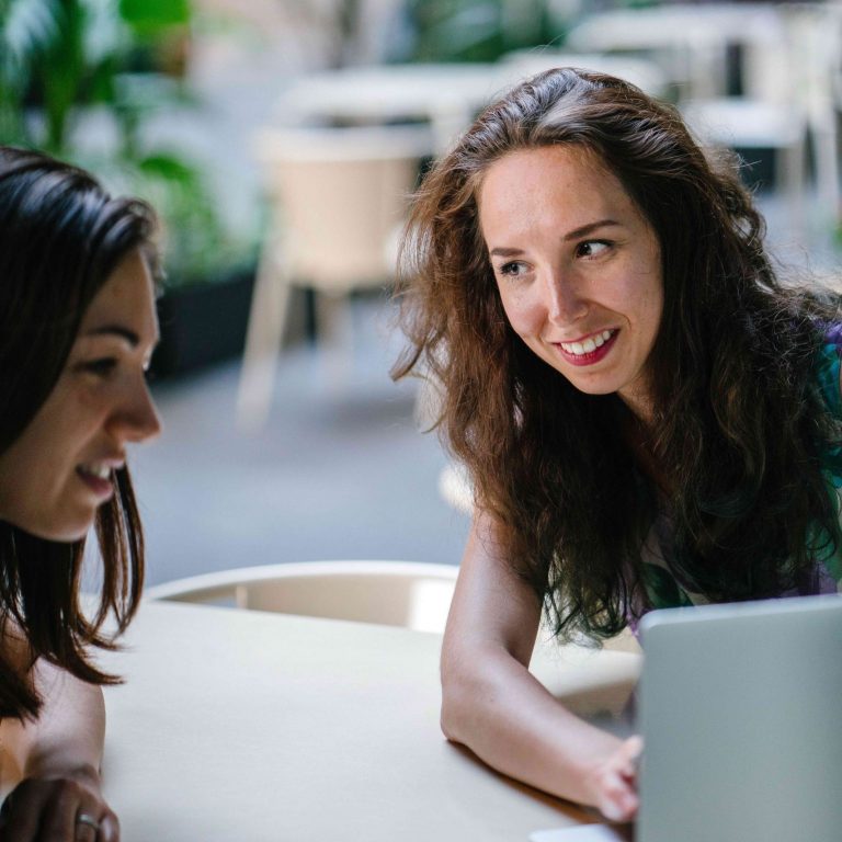 What’s the difference between a temporary staff agency or a placement agency? ladies looking at pc