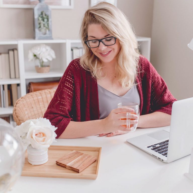 hire-domestic-staff-guide-2020 girl working happy at pc