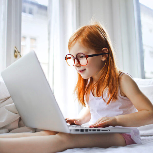 online-tutor Child learning on laptop