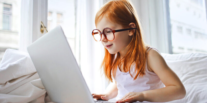 online-tutor Child learning on laptop