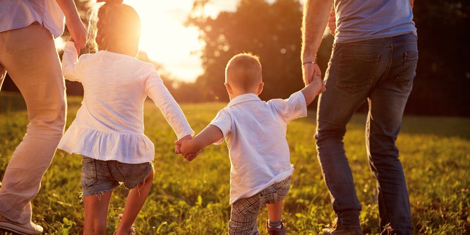 employ a norland nanny happy family at sunset