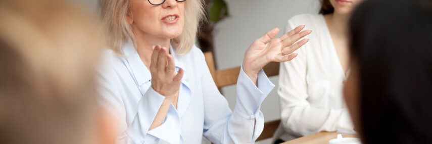 Aged businesswoman, teacher or business coach speaking to young people Recruitemnt